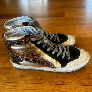 Golden Goose Women's Black, Gold, and Leopard Penstar Slide Sneakers.